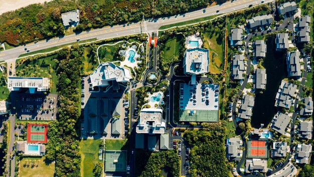 An aerial view of a diverse real estate portfolio, including residential buildings, commercial properties, and industrial sites. This image showcases the importance of diversification in REIT management and the breadth of assets under management.