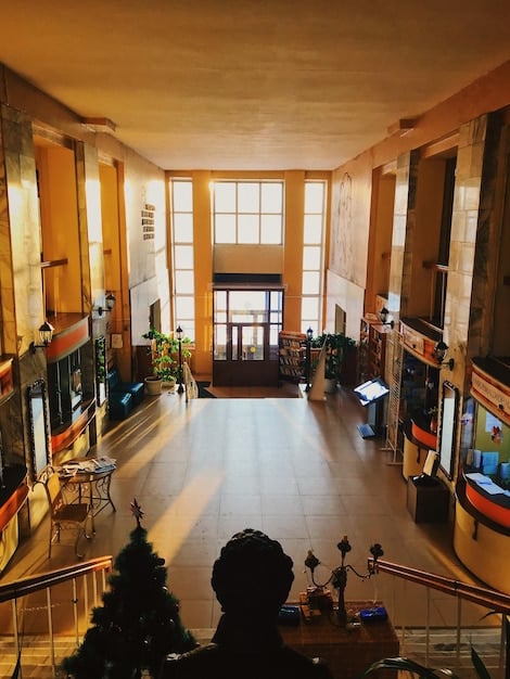 Interior of a modern apartment complex with well-lit hallways, common areas, and visible amenities that highlight the focus on residential living and community.
