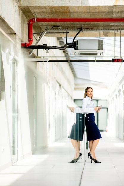 A property manager inspecting a commercial building's HVAC system, ensuring the proper functioning and maintenance of the equipment. The scene captures the attention to detail required in property management.