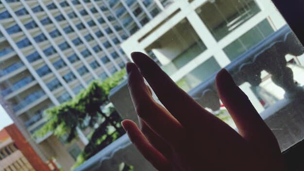 A close-up of a hand holding a dividend check, subtly emphasizing the income-generating potential of REITs, with a blurred background of office buildings to represent the real estate aspect.