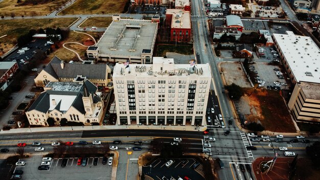 An image showing different types of commercial properties (office buildings, shopping malls, apartments) to visualize the diverse assets that REITs may hold. The image should have a sunny, prosperous feel.