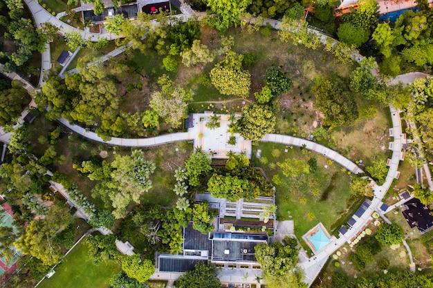 An aerial shot of a revitalized commercial property, showcasing modern amenities and landscaping, symbolizing improved property value and attractiveness to tenants